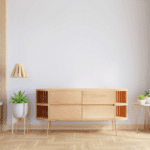 wooden tv console against an off-white wall